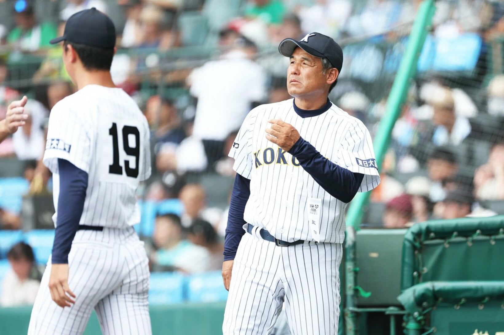 チームに「考える野球」を根付かせた東日大昌平・江井監督(右)