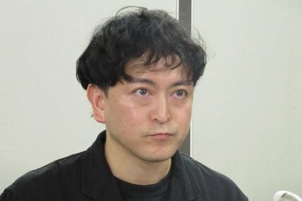 会見する篠山輝信