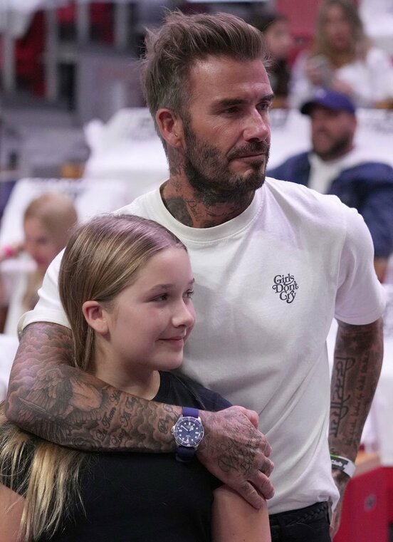  ベッカム氏と末娘のハーパーさん（ロイター）